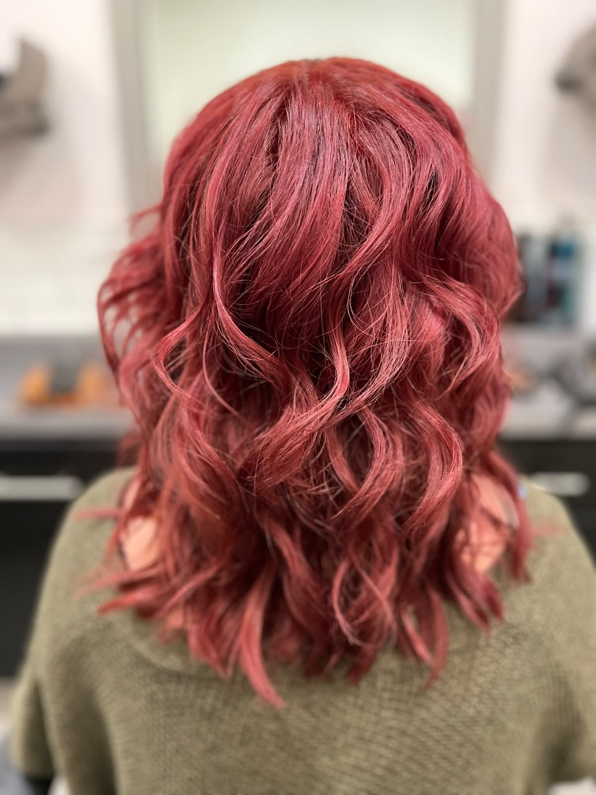 Rich red waves by Kelly May at Shear Bliss